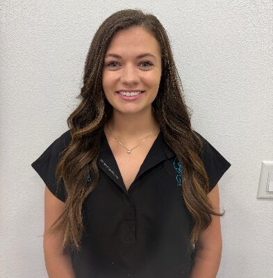 Katelynn, Graf Orthodontics clinical assistant, smiling in a professional setting.